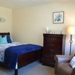 Comfortable Bed, Dresser for storage, and a big comfy chair